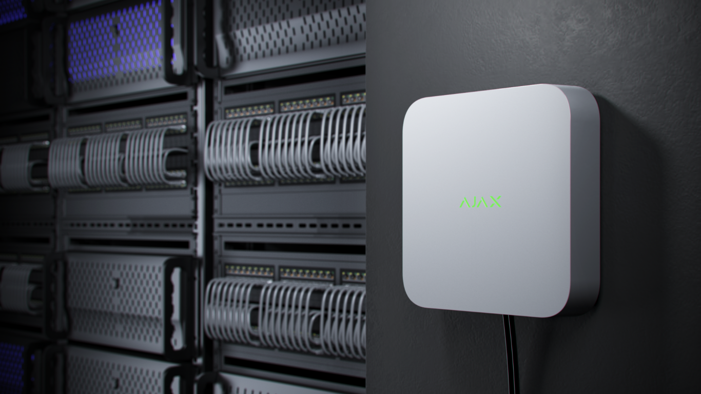 Videorekorder Grauer Netzwerkrouter an einer Wand, neben einer Reihe von Netzwerkgeräten.